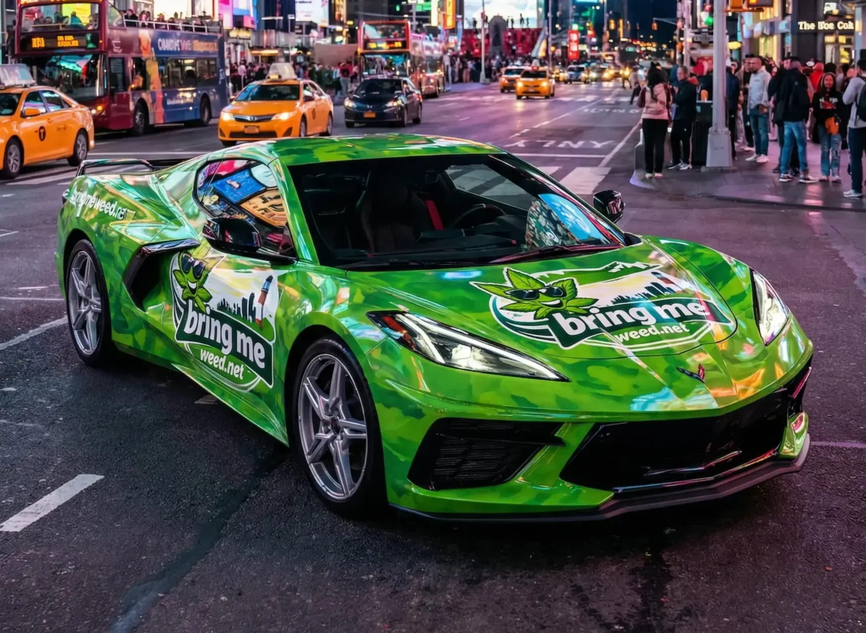 Bright green sports car with advertisement in Times Square at night.