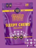 A purple package of Cheeba Chews Sleepy Chews Chocolate with yellow text. The bag highlights CBD and THC content and shows a small chew in the lower right corner. The background is also purple.
