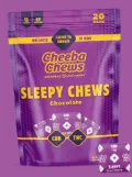 A purple package of Cheeba Chews Sleepy Chews Chocolate with yellow text. The bag highlights CBD and THC content and shows a small chew in the lower right corner. The background is also purple.