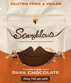 A bag labeled "Scandalous" features dark chocolate toffee sea salt, gluten free and vegan treats.