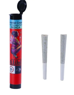Two cannabis pre-rolls rest beside a red "Caramel Cream Indica" tube with the black lid open.