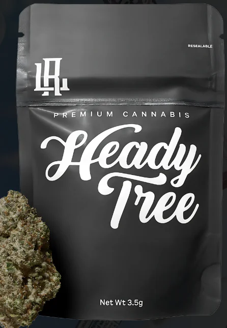 Black Heady Tree cannabis bag with bold white text, resealable label, and a cannabis bud nearby.