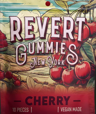 A package of Revert Gummies New York, cherry flavor, features cherries and a countryside backdrop.