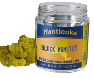 A jar labeled "Nanticoke Block Monster" sits on a white background with cannabis buds beside it.