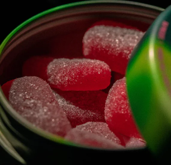 Close-up of sugar-coated red gummy candies, ideal for Cannabis Delivery Long Island orders.