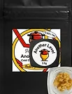 A black packet reading “Another Level” sits next to a container filled with golden, crumbly cannabis concentrate.
