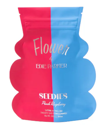 A pink and blue gummy candy pouch labeled “Flower by Edie Parker Seedies Peach Raspberry” is shown.