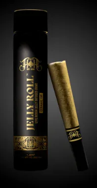 A black and gold Jelly Roll pre-roll tube and matching cone rest side by side on a dark background.