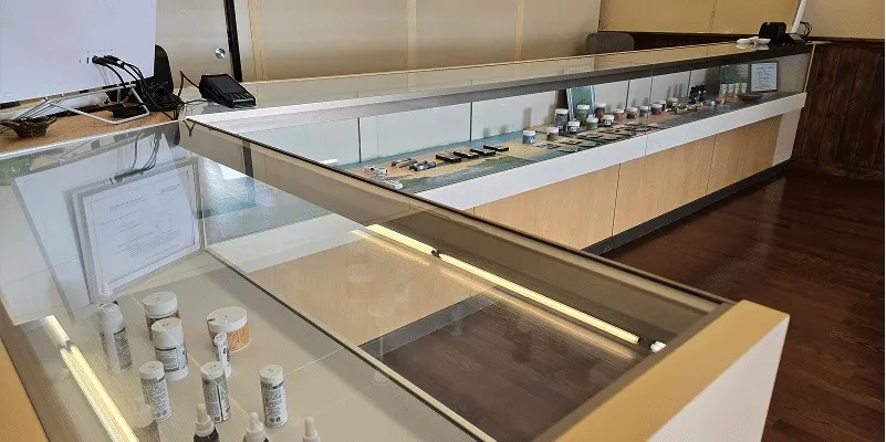 Glass display cases with cannabis products at High Falls Garden in Theresa, NY