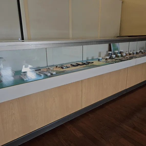 Cannabis product display case inside High Falls Garden dispensary